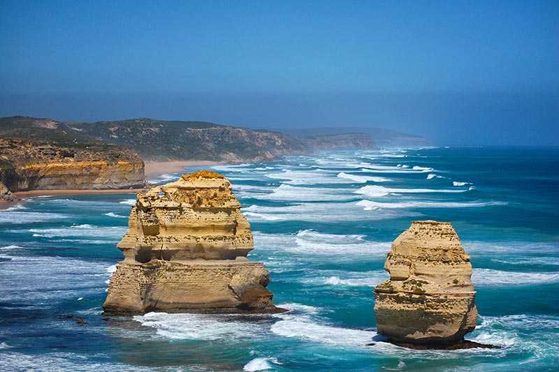 twelve-apostles-two-giant-rock-formations-part-of-the-twelve-apostles-arise-from-the-ocean-waves